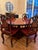 This substantial custom dining set, crafted in Bangkok in the 1980s, blends traditional Asian design elements with a clean...