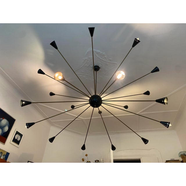 Large italian chandelier sputnik, italy, circa 1960 very big chandelier, brass, black lacquered metal, 20 bulbs condition:...