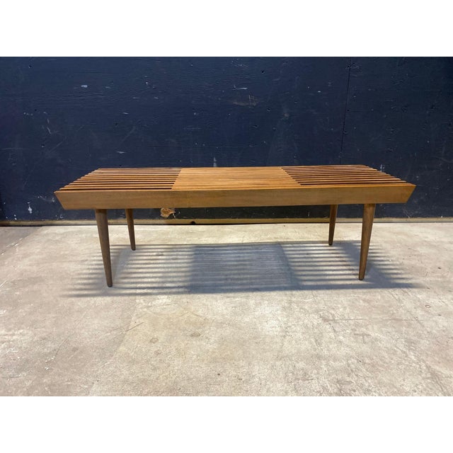 This is an adjustable Beachwood Bench made in Yugoslavia in the 1960's. The bench measures 15" high x 18" deep x 48" wide...