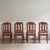 These eight French dining chairs were made around 1920 in the Rococo style, adopting its flowing lines and ornamental...