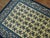 Floral vintage Chinese rug in shades of creamy white and blue. Measures: 5'1'' x 8'1''.