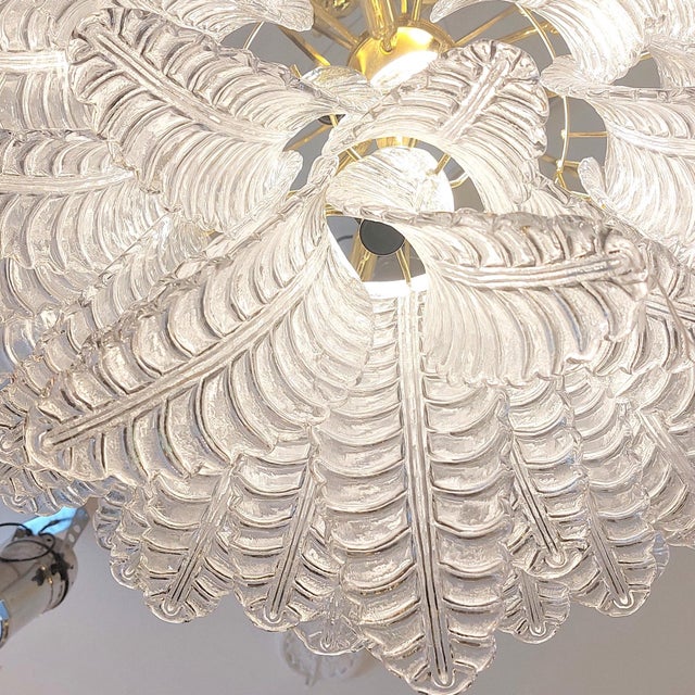 Murano glass ceiling lamp. Made up of multiple handcrafted Murano glass pieces shaped like leaves, this majestic piece is...