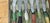 Vintage set of cheese knives with ceramic handles in the shape of vegetables.