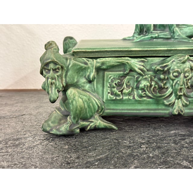 A somewhat rare and unusual arts and crafts terracotta lidded box in a beautiful matte “Grueby” like green glaze featuring...