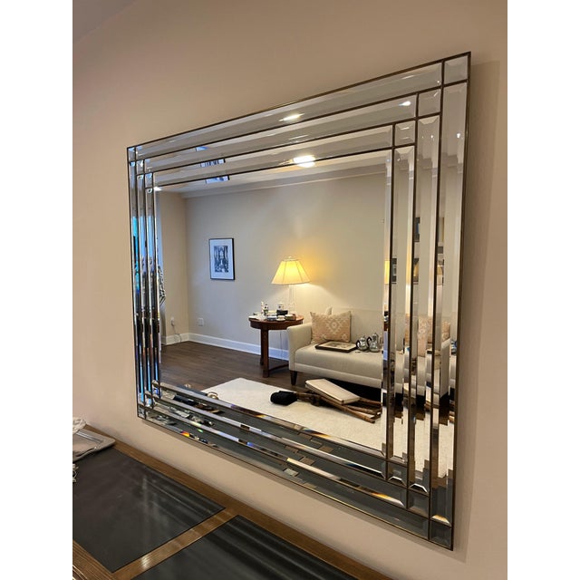 Stunning LaBarge beveled mirror with bronze trim. Elegant rectangular wall mirror made in Italy for LaBarge, featuring...
