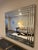 Stunning LaBarge beveled mirror with bronze trim. Elegant rectangular wall mirror made in Italy for LaBarge, featuring...