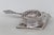 This beautiful Tea Strainer is made of metal and silver plated. This lovely silver tone piece is marked on the back with...