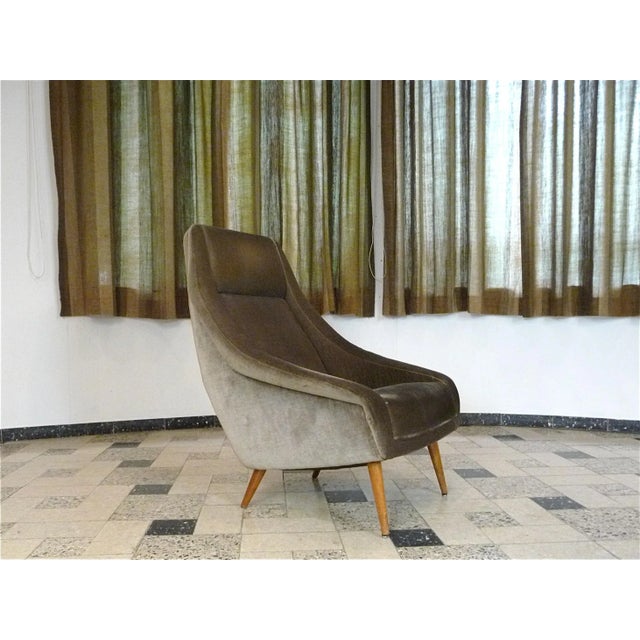 This Italian highback chair was made in the 1950s and is covered with mohair in a warm brown tone. The chair features...