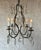 This charming French chandelier, circa 1940s, features a silvered metal structure with four arms, wired for candelabra...