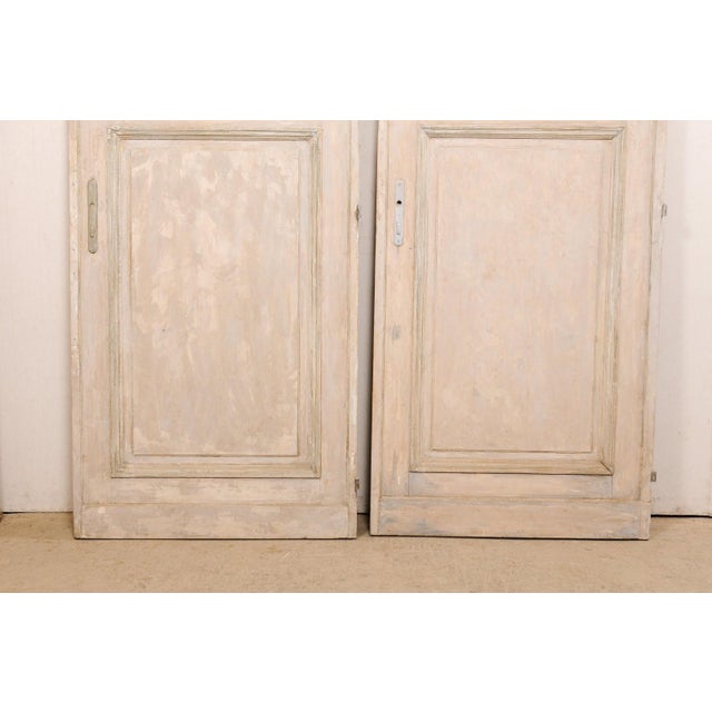 A French set of two doors, both singles, from the 19th century. These antique doors from France, though not meant to match...