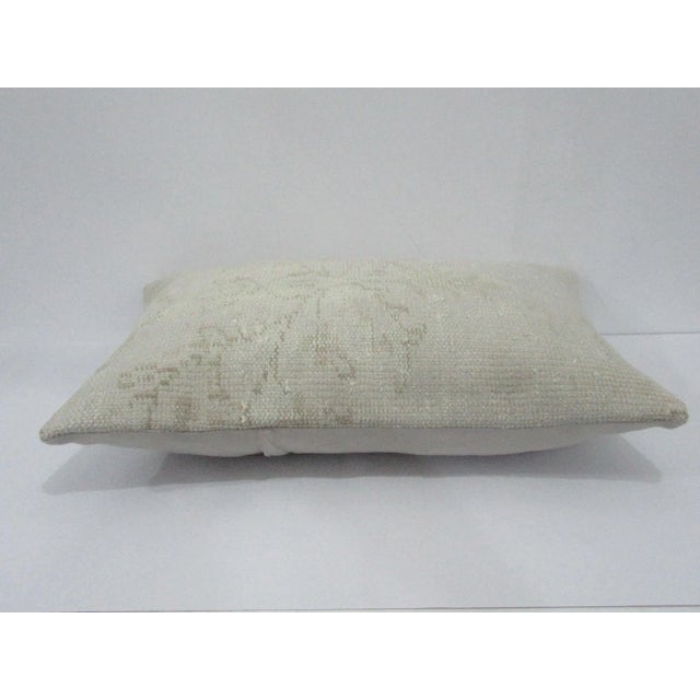 Decorative pillow cover made from a vintage Turkish handknotted rug. Backed with good quality cotton fabric. Pillow...