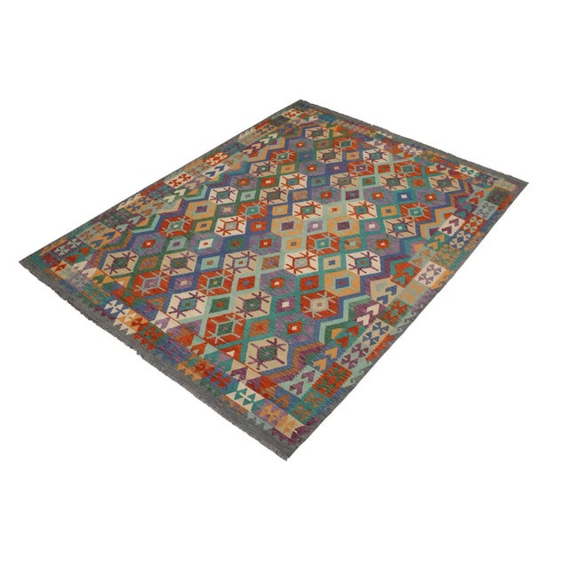 Add a touch of elegance to your home with this casual chic hand woven Tribal Kilim wool rug. Constructed on a loom by...