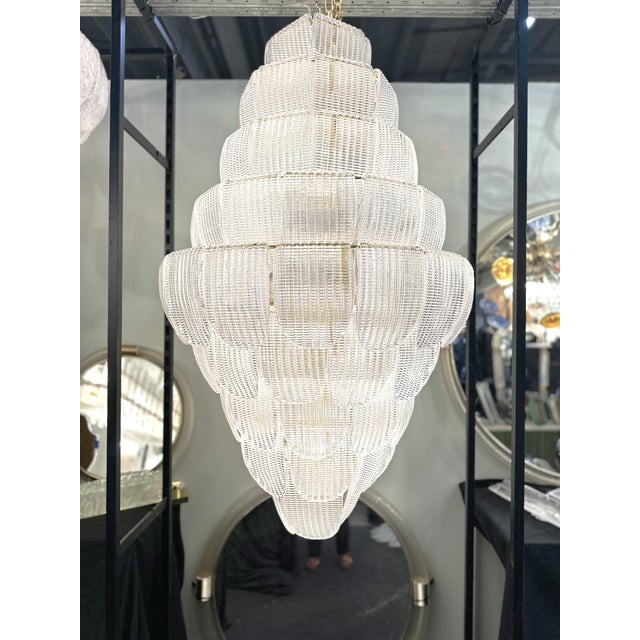 Luxury modern chandelier with sanded pink and amber ”Petals” in Murano glass . Hand-made in Murano glass , all made in...