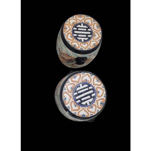 An incredible pair of vintage ceramic Chinoiserie garden stools. The stools are whimsical and so special. They feature...