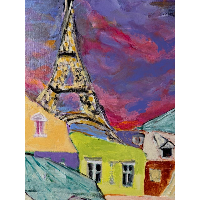 A whimsical vision of Paris comes alive beneath a dramatic twilight sky. Colorful rooftops, glowing windows, and the...