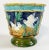Vibrant antique Majolica jardinière featuring raised relief faux bamboo rim and frames with four dividing images on a rich...