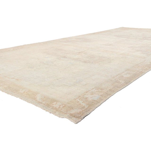 53712 Vintage Turkish Oushak Rug, 06'06 x 15'03. Reflecting elements of Shibui with incredible detail and texture, this...
