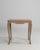 Executed in warm, golden oak with the graceful sensibility of the Louis XV period, this early twentieth-century French...