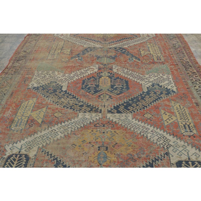 Handwoven in wool circa 1850–1870, this 9x12 antique Soumak rug is a rare and collectible example of flatweave...