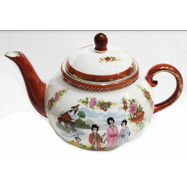 Charming porcelain Japanese tea service for 4. Images depicting four lovely Geisha. The Japanese word geisha literally...