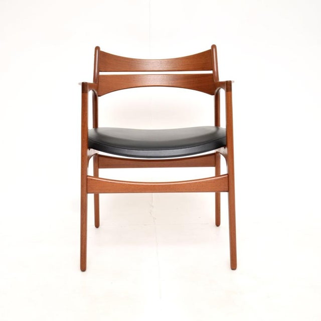 A stylish and incredibly well made Danish vintage teak carver desk chair / armchair by Erik Buch. This was made in Denmark...