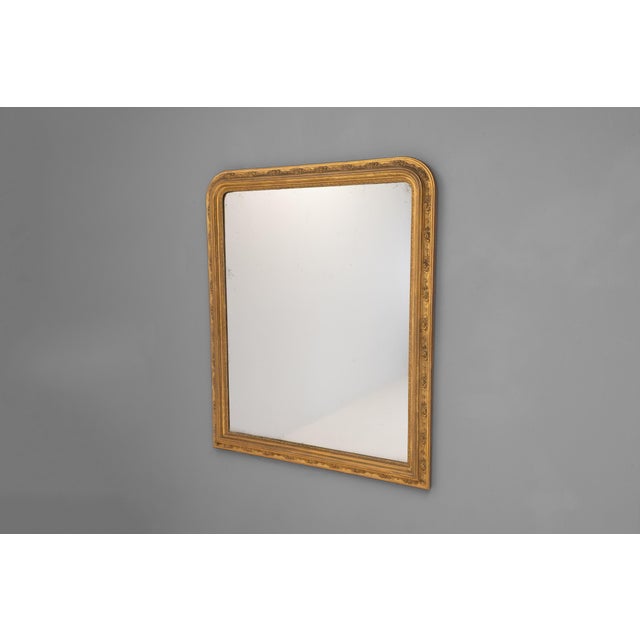 Gilded French overmantel with decorative detail to frame and original mirror plate. France circa 1860.