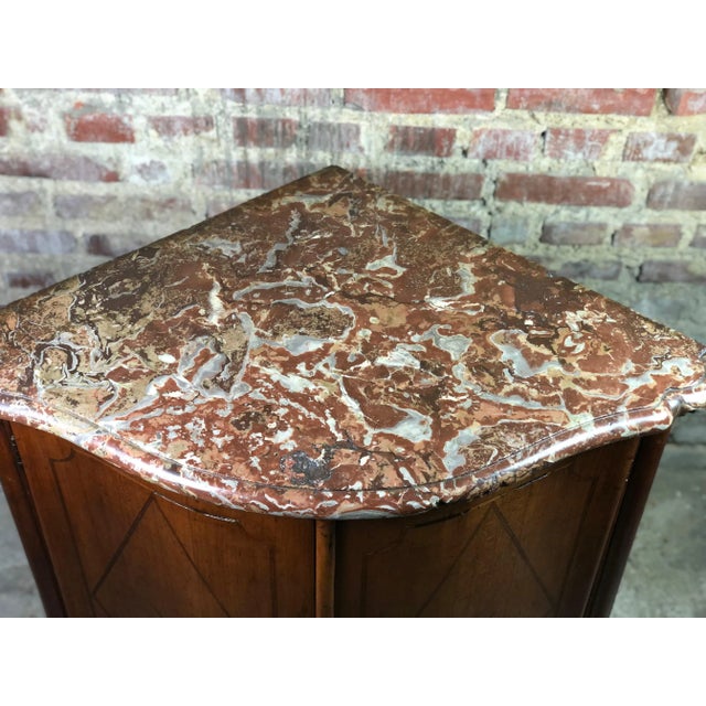 Curved cabinet of the louis xv period in marquetry with rose decoration on the doors. stamped: jean-baptiste galet -...