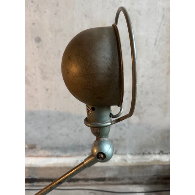 Two-armed industrial lamp designed by Jean Louis Domecq produced by Jieldé, France 50's. The lamp is mounted on a brake...