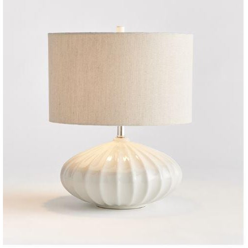 In stunning detail, a curvy ceramic base is the defining feature of this gorgeous lamp. The sweeping design and grand...