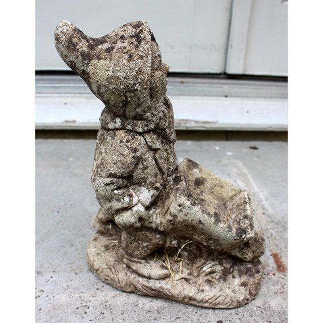 English cast stone mid-20th century gnome planter garden ornament. He is pushing his wheelbarrow - a small planter. Very...