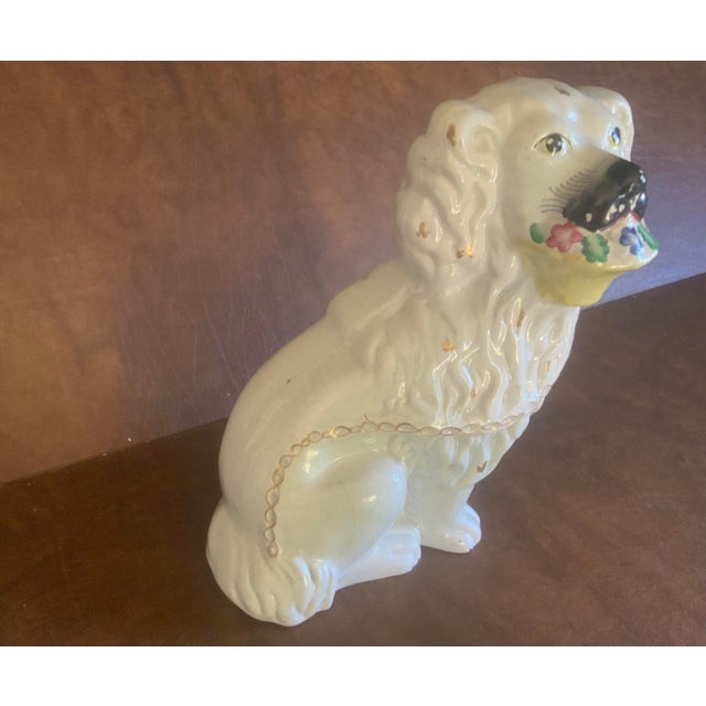 A collector’s dream; a large basket Staffordshire dog available.