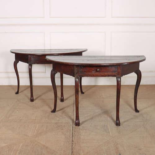 Good pair of 18th century Italian walnut demi-lune console tables with wonderful colour. 1760. This piece is designed in...