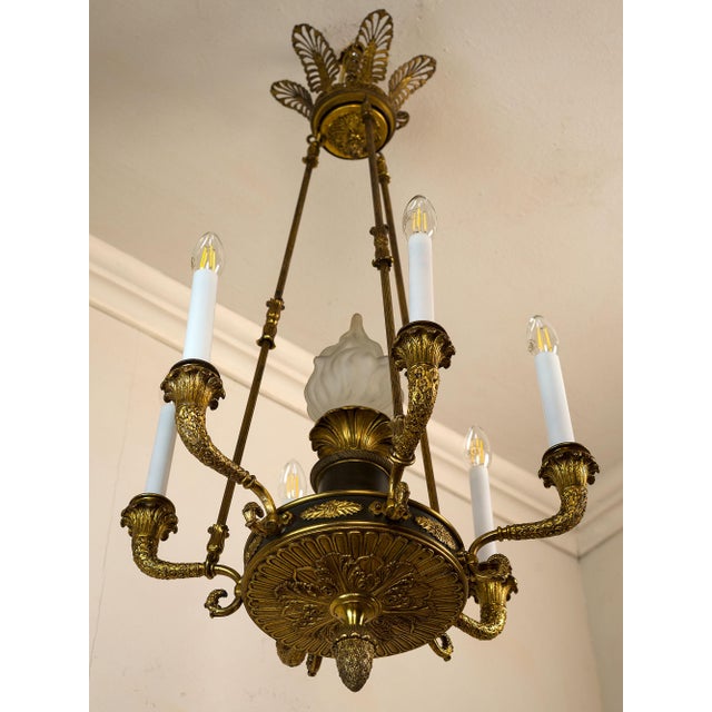 Antique Empire-style chandelier in chiseled and gilded bronze, made in France between the late 19th and early 20th...