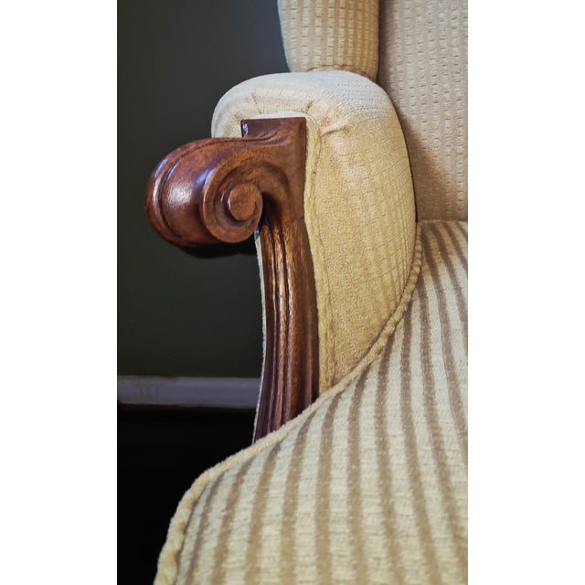 Wood Antique Upholstered Wingback Armchair With Carved Wood Arms For Sale - Image 7 of 15