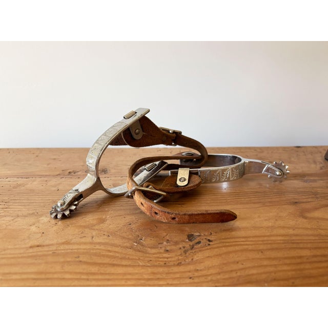 Kick up the western vibes in your western décor with this vintage pair of Kelly Brothers cowboy spurs. These are plated...