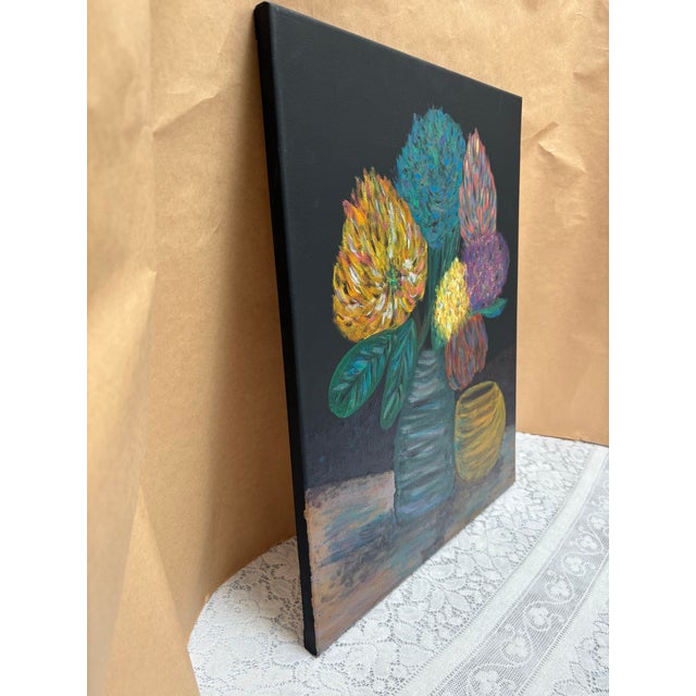 Original canvas painting of vibrant lush exotic flowers in a vase along side a gold bowl against a black background. The...