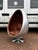 Aviation Swivel Egg Chair with Tan Leather. Sizes 145 cms tall, 99 cms A used item so will have signs of use, See pics