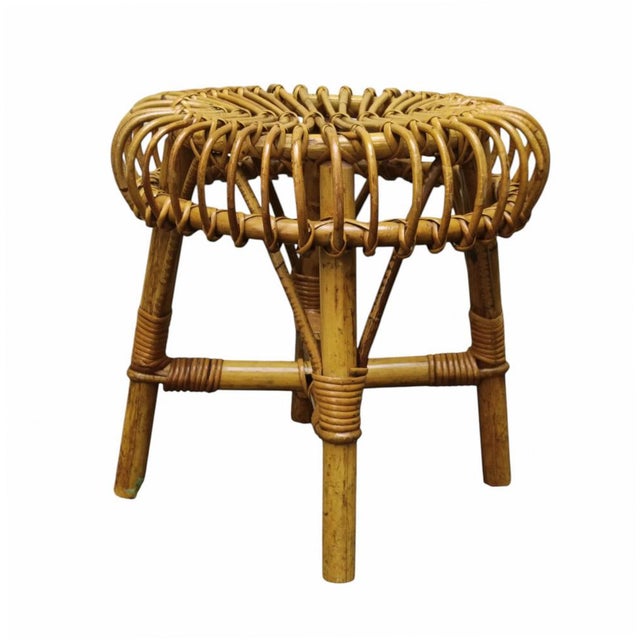 A round stool in curved rattan and bamboo from the mid-20th century, designed by Francesco Albini. Albini was among the...
