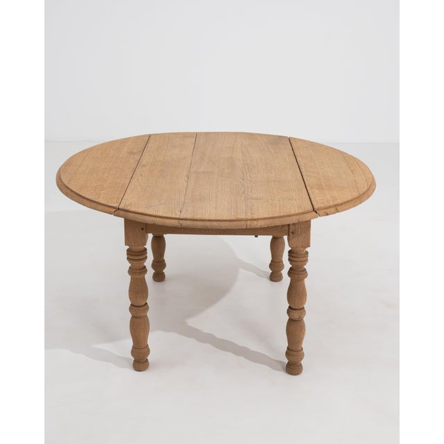 A supremely refined example of early twentieth-century French craftsmanship, this drop-leaf side table is rendered in...