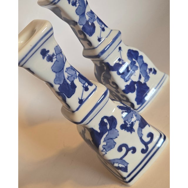 This is a gorgeous pair of flowers blue candlesticks in a vivid blue delft color. I have a single, matching pillar style...