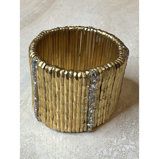The Giora Gold Stretch Cuff Bracelet is a sleek, modern piece of jewelry txhat combines the elegance of gold tone with the...