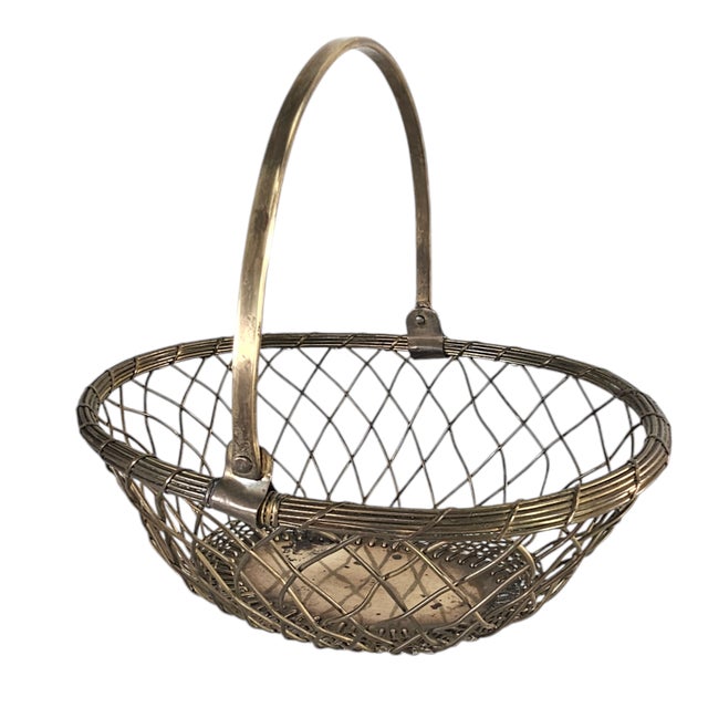 Formed in solid brass with an open lattice structure, this mid-century basket reflects the handcrafted metalwork imported...