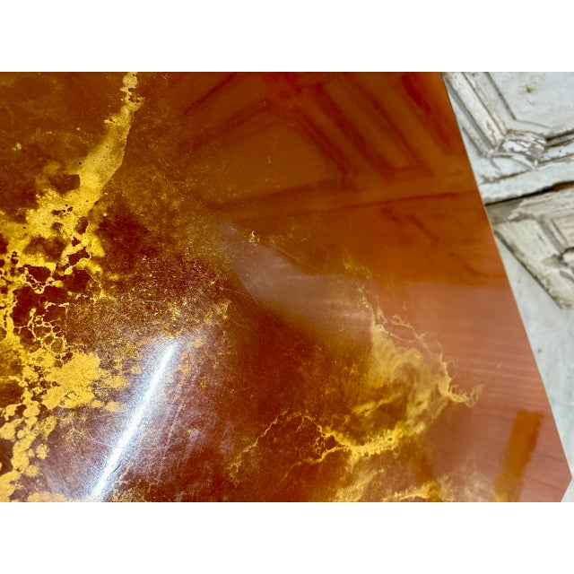 Brass coffee table with a lacquer-effect top, attributed to Guy Lefèvre for Maison Jansen, circa 1970. Some oxidation...