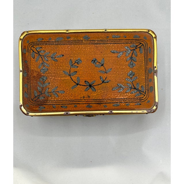 This early 20th-century Chinese wooden box, measuring 6 3/4" L x 4 1/4" W x 2 1/2" H, is elegantly covered in decorated...