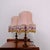 This pair of vintage table lamps features a brass base and pink lampshades decorated with beaded fringe. 1960s/1970s...