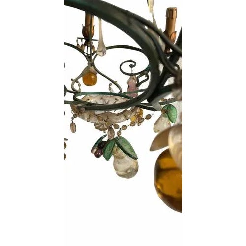Vintage wrought iron chandelier, decorated with pendants of various shapes and sizes and a floral theme made of Murano...