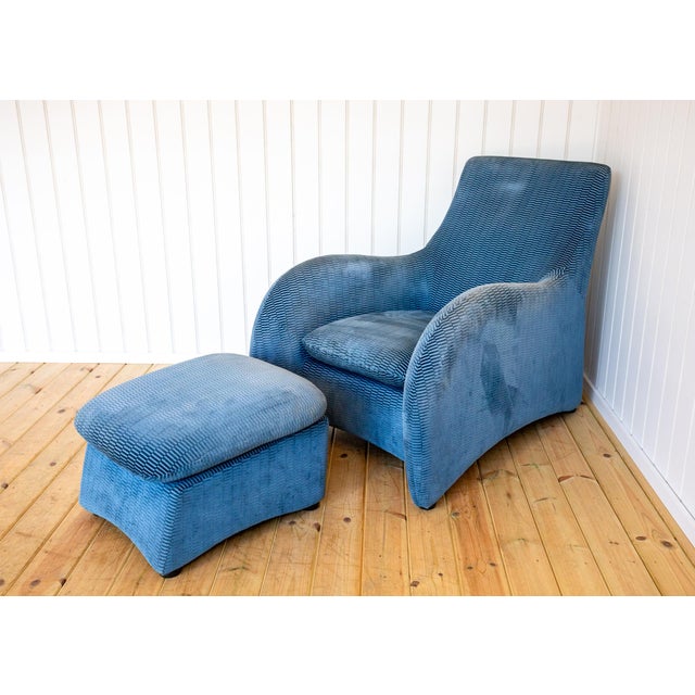 A rare and strikingly attractive post-modern designer armchair and footstool in lovely vintage condition. Designed by...