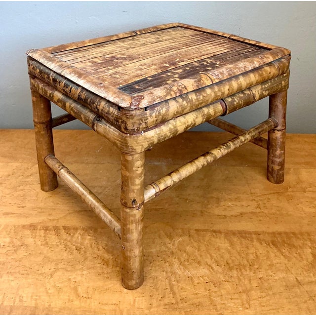 Exuding relaxed mid-century charm and organic appeal, this vintage rattan accent table brings a touch of tropical resort...