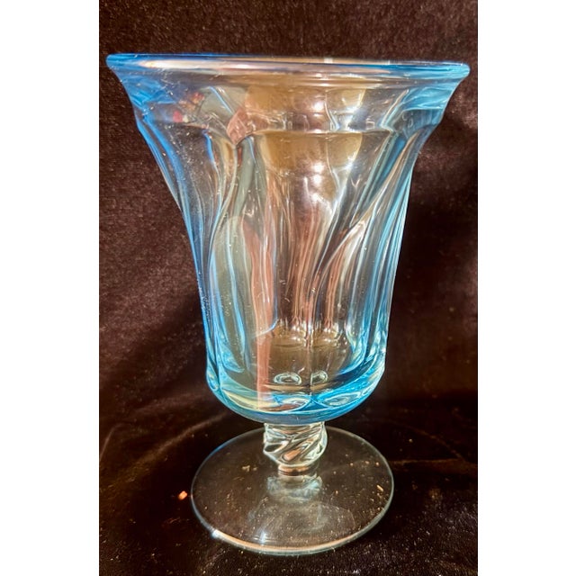 This is a collection of 14 vintage Fostoria Jamestown ice tea glasses in the iconic blue colorway and characterized by a...