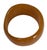 This vintage bakelite bangle bracelet features a rich caramel-orange color with a subtle marbled pattern. Why the shape...